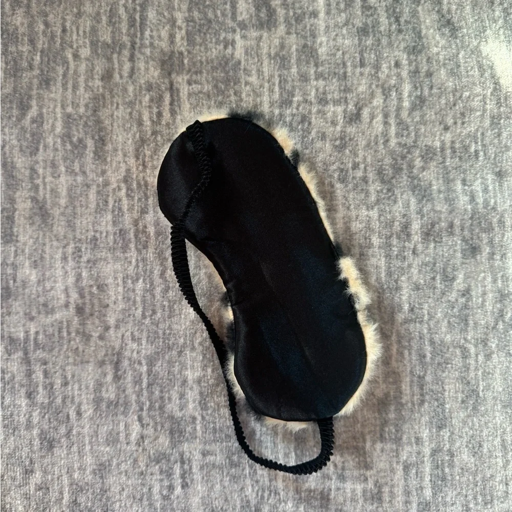 Fuzzy black and cream sleep mask